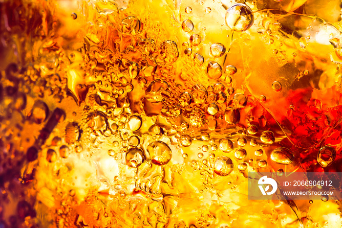 cola drink with ice cubes texture and bubble as a abstract background