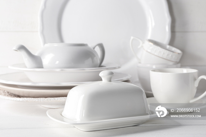 Set of clean dishware on white table