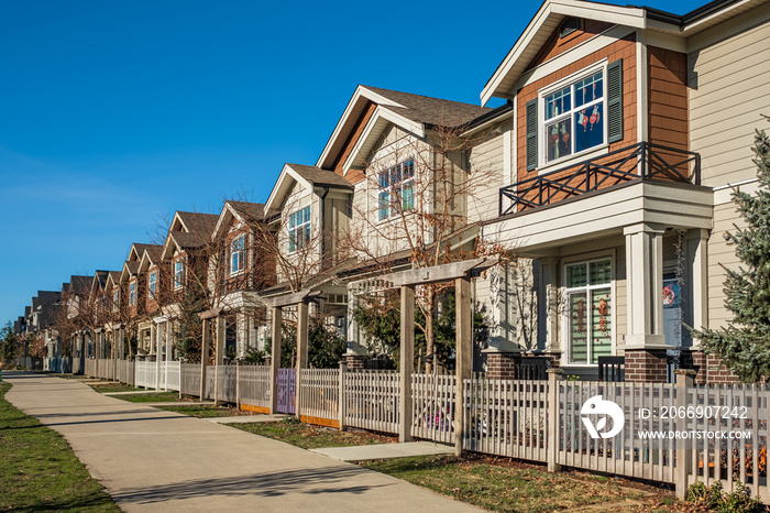 Modern residential houses neighborhood street in a suburban residential area. New and comfortable neighborhood