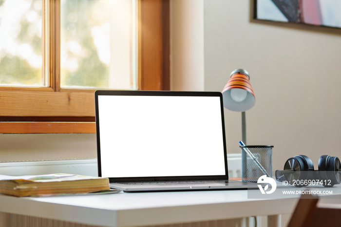 Modern freelance designer workplace in home office with laptop computer mockup. Remote education, online learning concept. Copy space