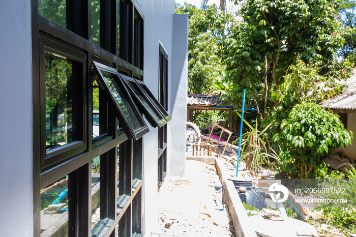 Modern black frame glass window tropical house
