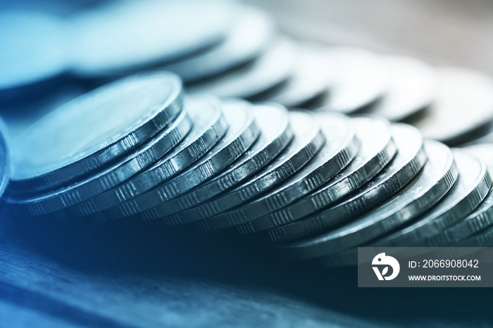 Row of coins on wood background for finance and Saving concept,Investment, Economy, Soft focus and dark style.