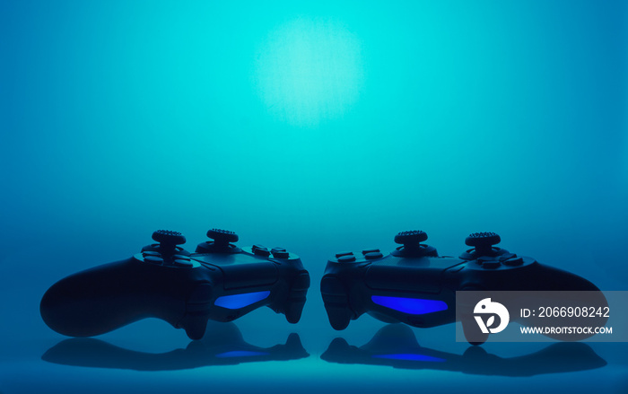 game joysticks sillhouettes - without any logos on blue background