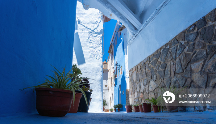 Narrow streets of Chelva, picturesque and brightly painted houses, on a sunny day.