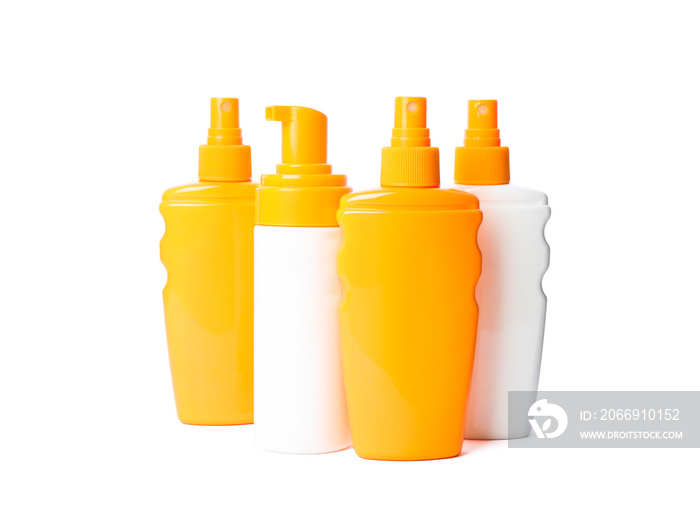 Many different sunscreen sprays isolated on white background. Summer vacation accessories