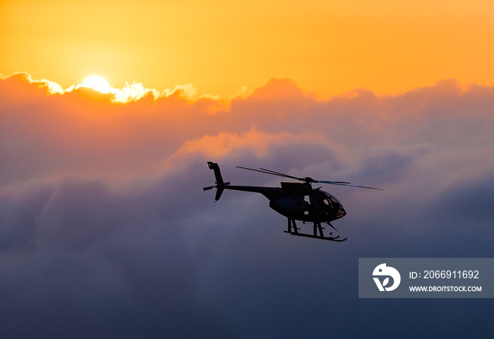 Hawaiian helicopter flying toward Killauea crater