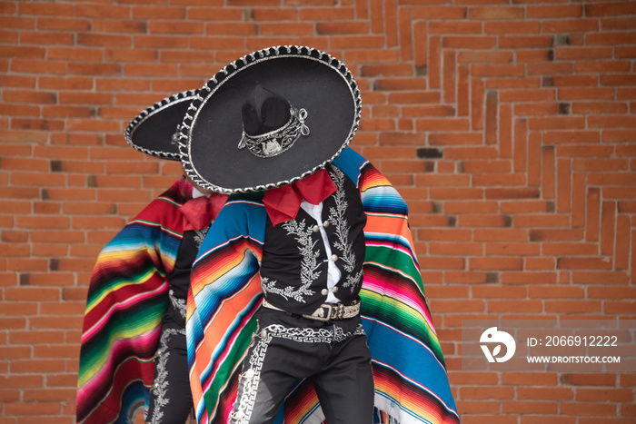 Mexican charro dancer with sombrero and multicolored serape from jalisco mexico with mariachi music