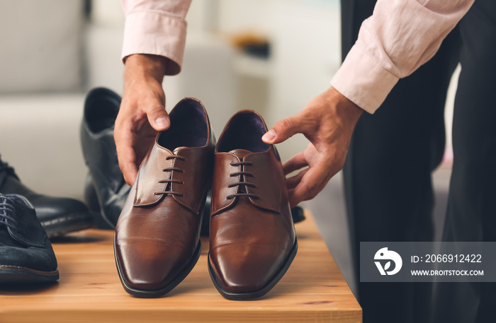 Male seller in shoe store