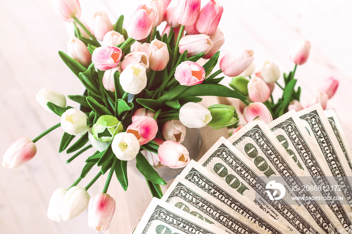 tulips pink white bucket light background bouquet Fresh pink tulips on the dollars banknotes background