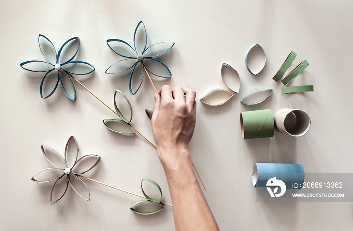 Flowers from toilet roll tube for Mother Day, zero waste crafts for kids, school and kindergarten, creative seasonal idea for holidays and leisure, plain neutral pastel background