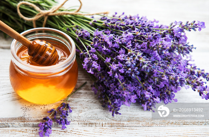 Jar with honey and fresh lavender