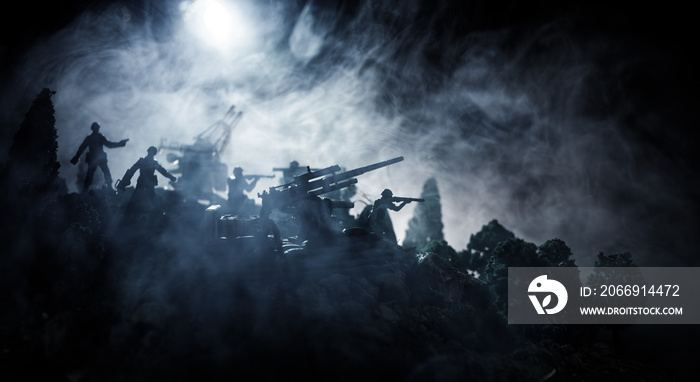 War Concept. Military silhouettes fighting scene on war fog sky background, World War Soldiers Silhouettes Below Cloudy Skyline At night. Attack scene. Selective focus Tanks battle. Decoration