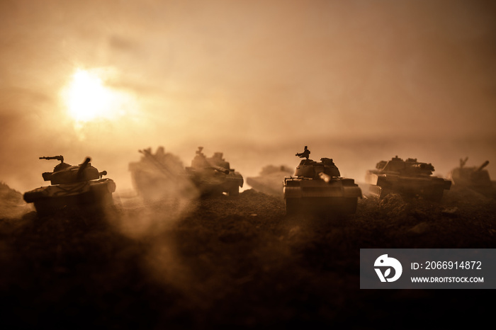 War Concept. Military silhouettes fighting scene on war fog sky background, World War Soldiers Silhouettes Below Cloudy Skyline at sunset. Attack scene. Armored vehicles.