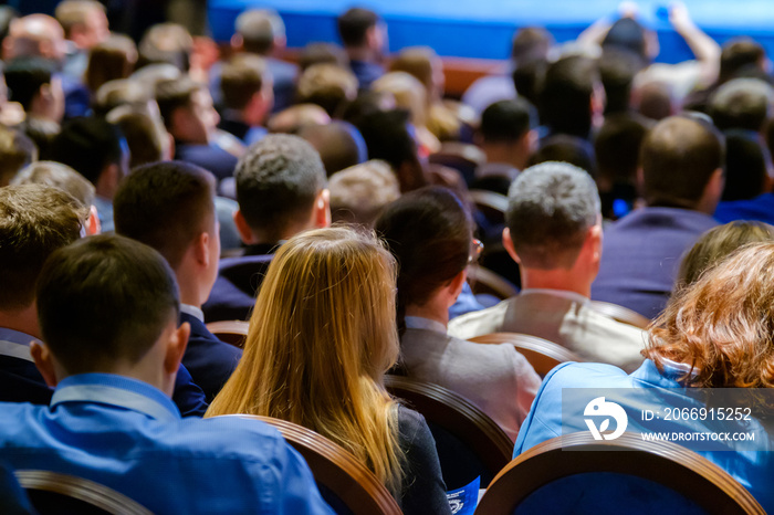 People attend business conference in the congress hall