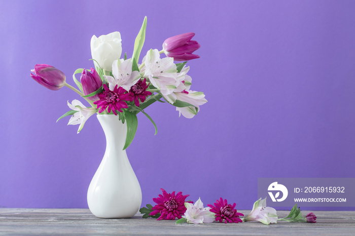 beautiful spring flowers in white vase