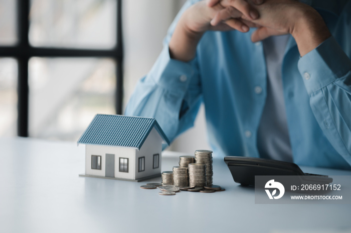 Person with stack of coins, saving money concept for future use and financial stability, savings for housing, payroll management, personal finance, investment savings.