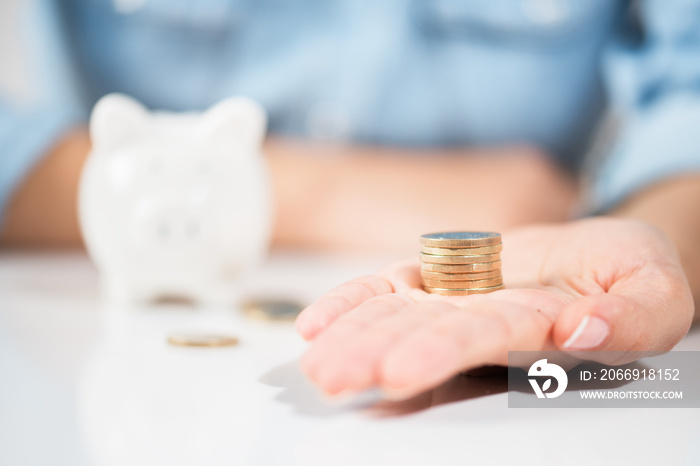 Woman holding Coins .Showing Save Money Concept