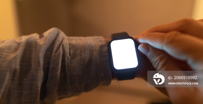 Close up of Businessman’s hand looking at hand watch