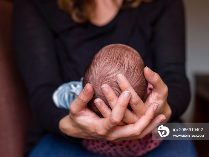 Close-up of woman holding baby son