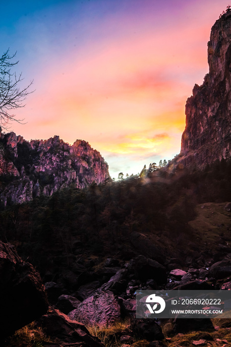 sunset in canyon with big cliffs in front, forest in basaseachi chihuahua