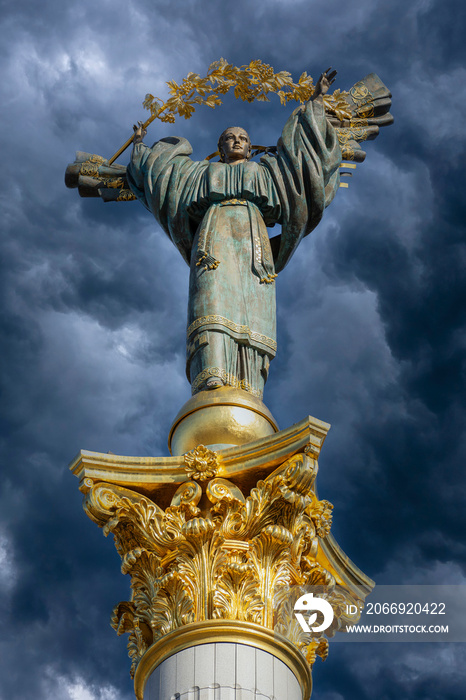 Independence monument on dark sky with clouds background in Kyiv, Ukraine