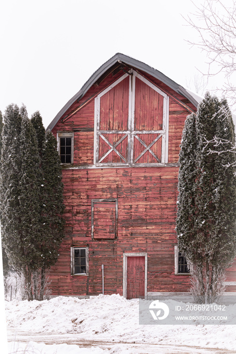 Red barn winter snow scene.