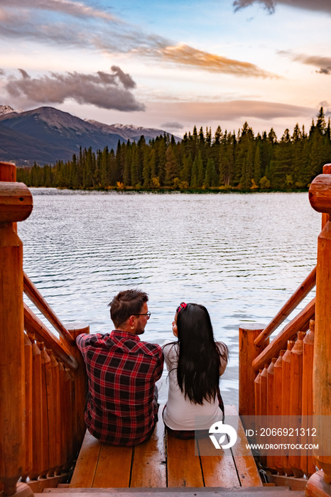 Beauvert lake at Jasper, Canada, Canadian lake popular for canoe. in the Canadian Rockies Jasper national park, couple men and woman mid age looking out over the lake