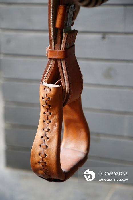 Leather stirrup. Close up. Horse saddle. Rider foot support. Argentine craftsmanship. Handmade. Ride. Horse riding. horseback riding.