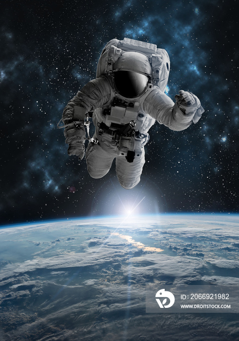 Astronaut in outer open space over the planet Earth.Stars provide the background.erforming a space above planet Earth.Sunrise,sunset.Our home. ISS.Elements of this Image Furnished by NASA.