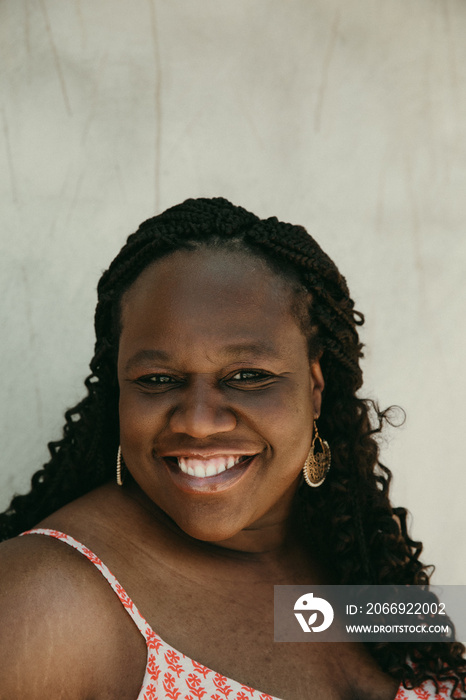 close up of a plus size African American woman smiling