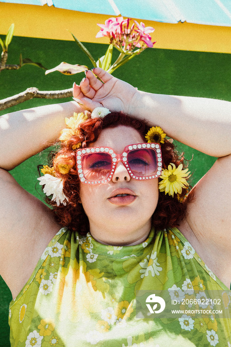 close up of plus size woman with red hair and sparkly sunglasses