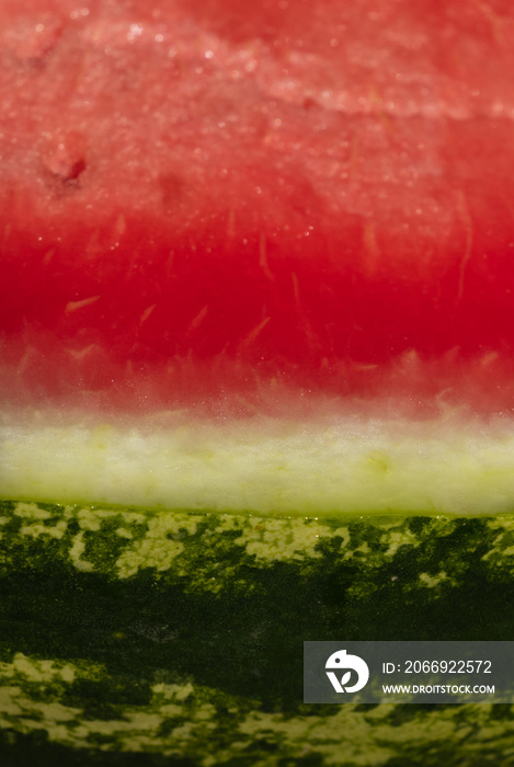 background. delicious red watermelon with black seeds and green skin