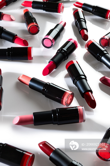 Lipsticks close up over white background