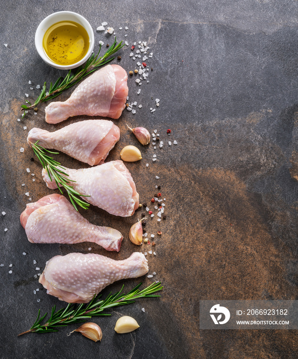 Chicken legs with spices and salt  ready for cooking.