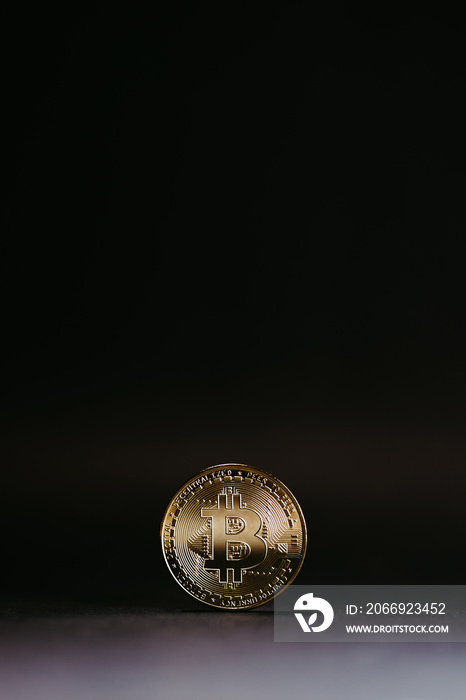 golden bitcoin coin with black background