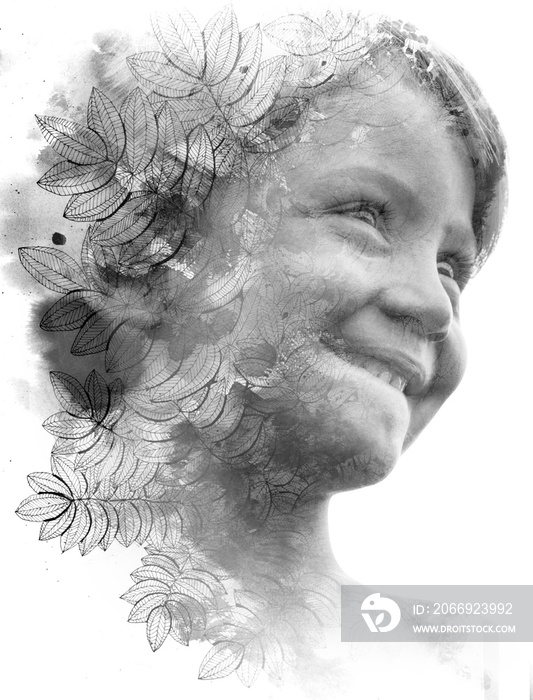 Paintography. Double Exposure portrait of a small child smiling blended with handmade ink drawing of leaves