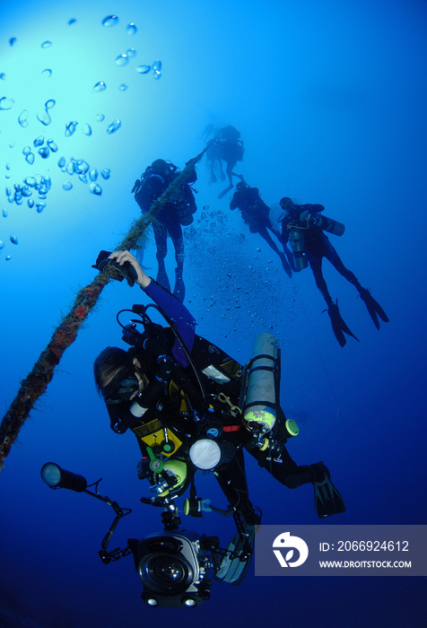 Scuba divers at decompression stop.