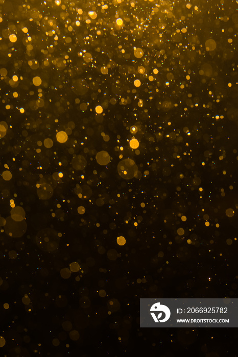 Abstract gold bokeh with black