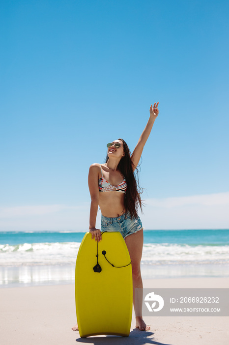 Woman surfer enjoying bodyboarding