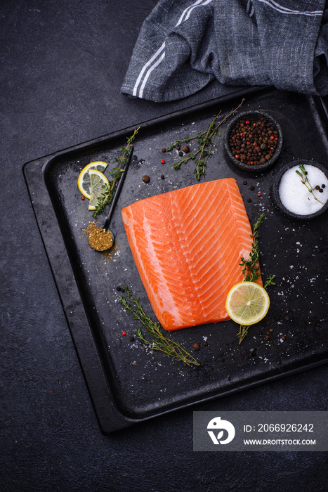 Raw salmon fillet with herbs