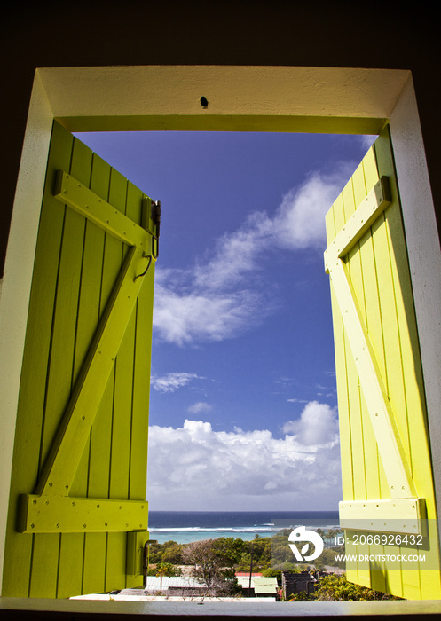 guadeloupe beach seen through yellow window