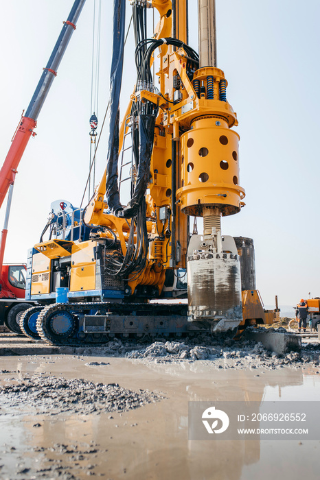 Drilling rig on a construction site. Drilled piles for the bridge foundation.