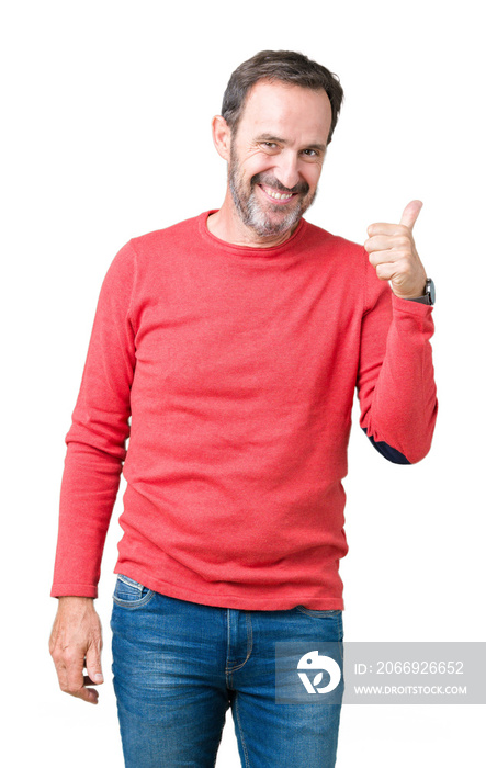 Handsome middle age hoary senior man wearing winter sweater over isolated background doing happy thumbs up gesture with hand. Approving expression looking at the camera showing success.