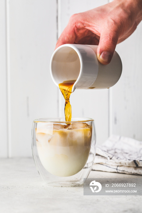 Ice coffee with milk in glass. Ice latte with soy milk.