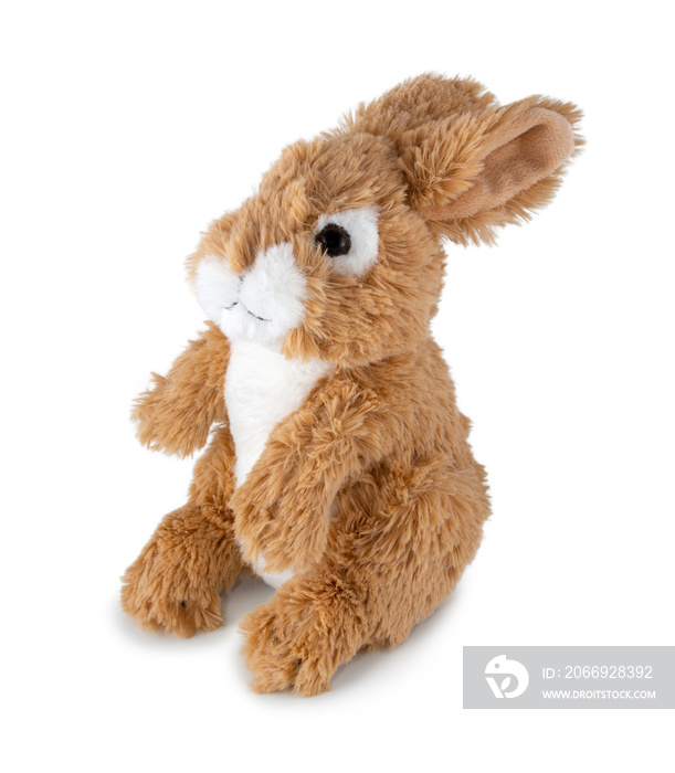 Cute rabbit doll isolated on white background with shadow. Playful brown bunny sitting on white underlay. Hare plush stuffed puppet toy for children. Plaything for kids.