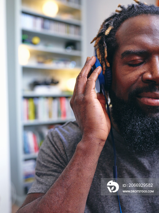 Man listening to music on headphones