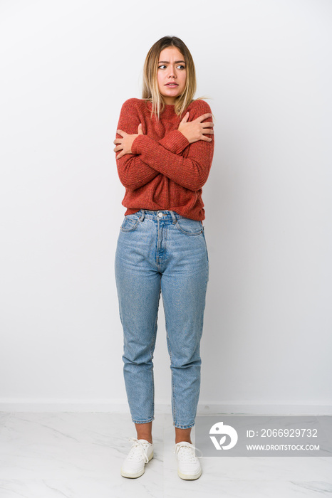 Full body young caucasian woman going cold due to low temperature or a sickness.