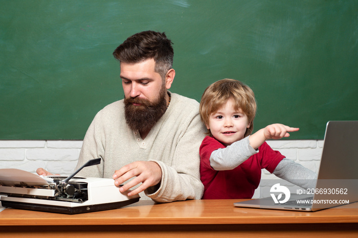 Little students. Teacher and kid. Daddy play with schoolboy. Daddy and his little son. Childhood and parenthood. Young boy doing his school homework with his father.