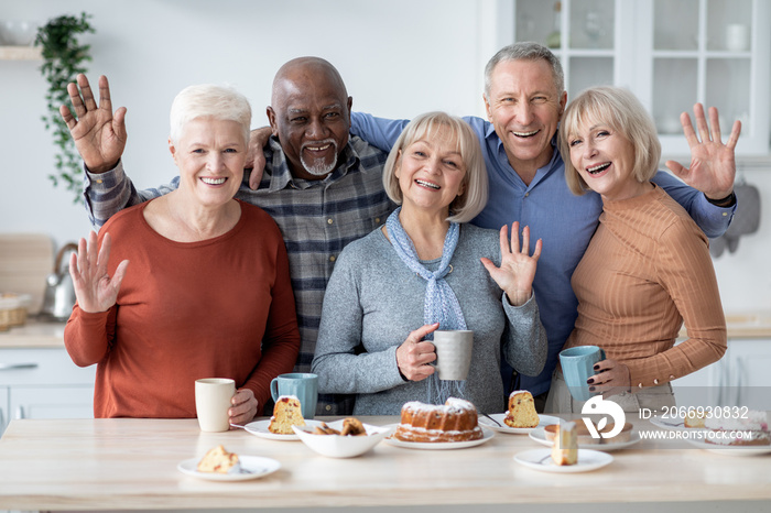 Portrait of cheerful elderly men and women spending time together