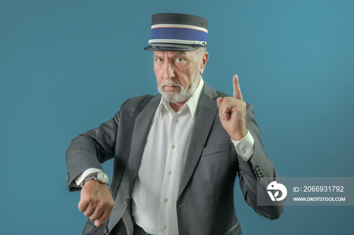 The conductor warns the passenger about the time of departure of the train. On a blue background.